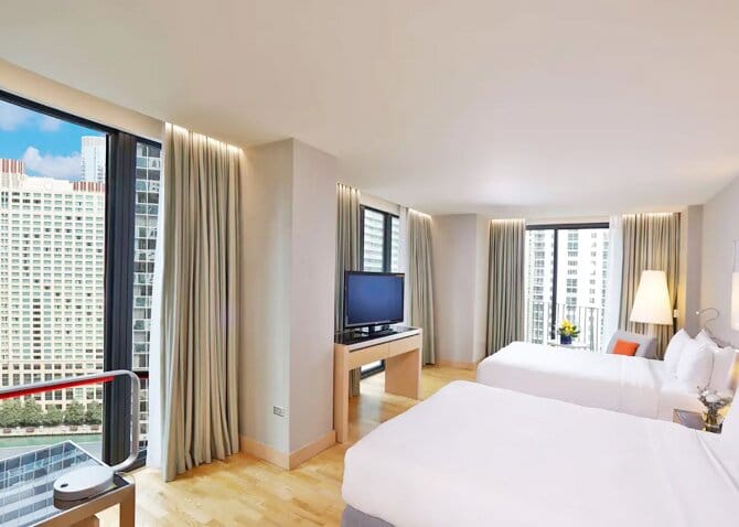 Interior of a modern hotel with window views on two walls