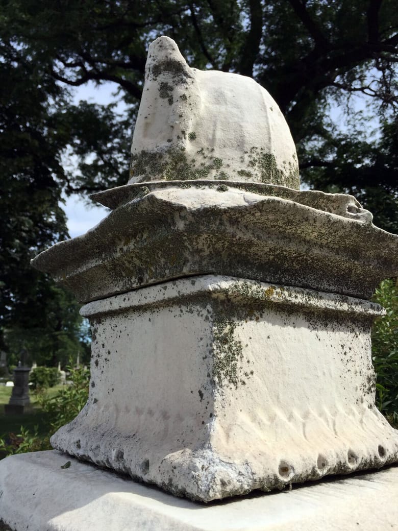 Stone statue of a fireman's hat