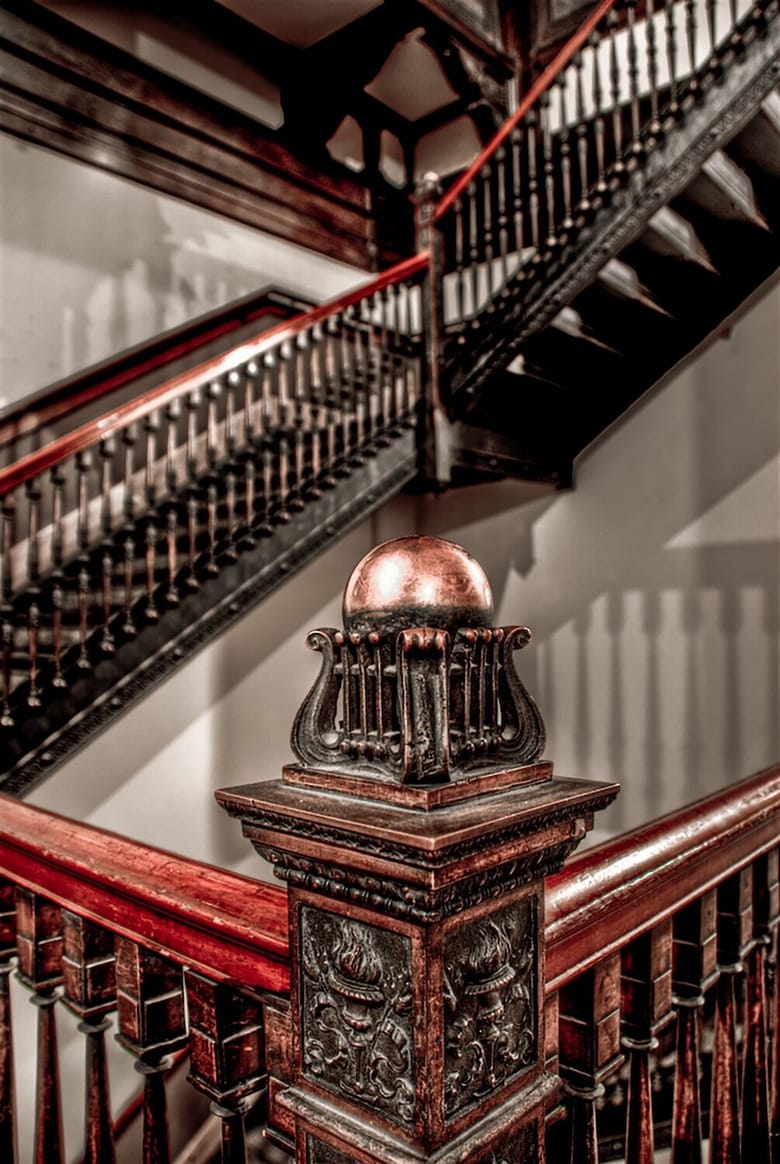 Detail of stair banister with intricate carvings