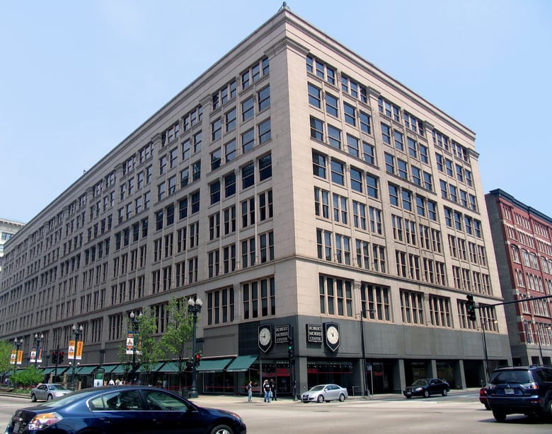 Exterior of grey stone building on city street corner