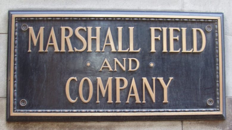 Bronze sign that reads "Marshall Field and Company"