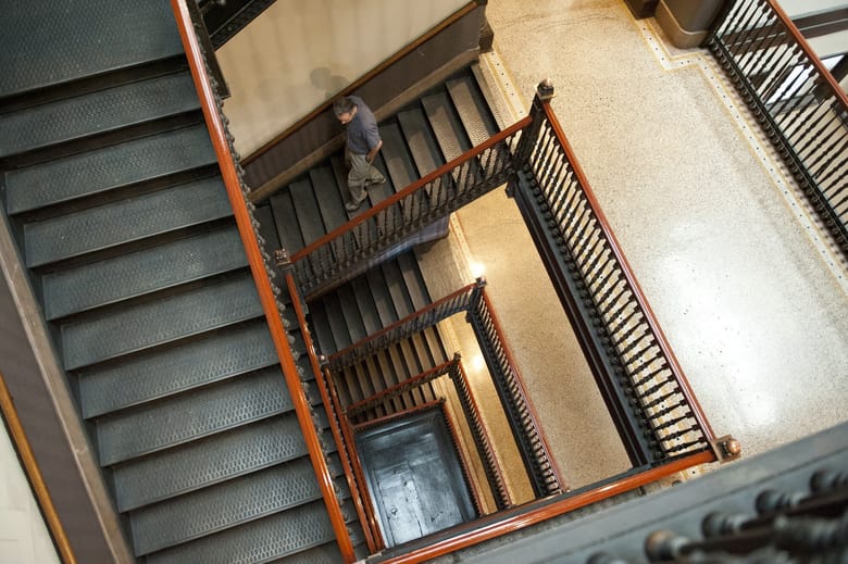 Interior of building through the view of center staircase