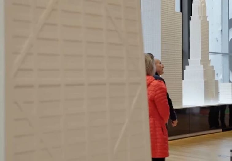 People looking at exhibitions of skyscrapers