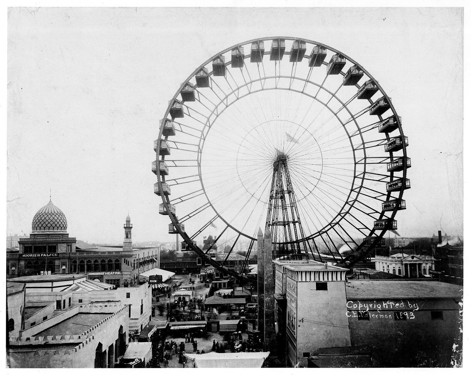Vintage black and white photograph of Gale Ferris Jr.'s original Ferris Wheel, towering over the Chicago skyline with its iconic structure.