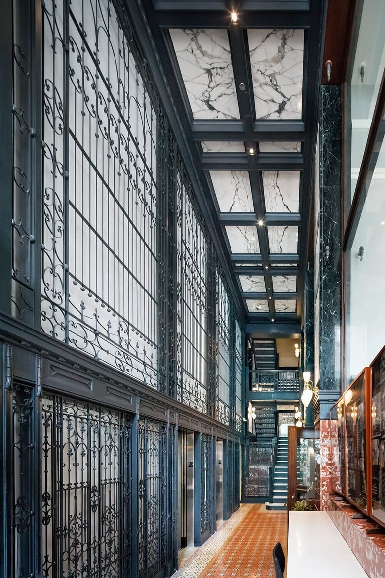 Lobby of the Reliance Building in Chicago, Illinois, showcasing elegant historic architecture with intricate detailing, large windows, and a bright, welcoming interior.
